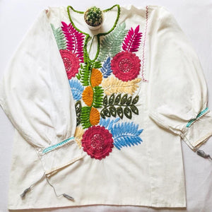 full view of white linen mexican blouse with embroidery