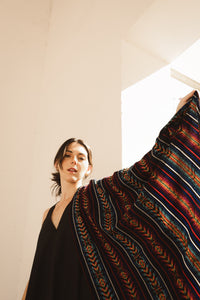 beautiful freckled model wearing a black wool rebozo